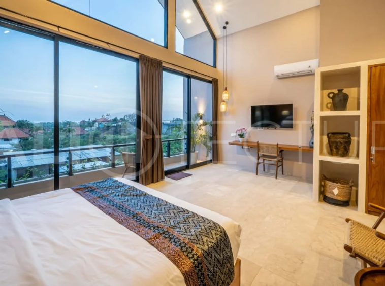 Brand-new 2-bedroom freehold villa near Pandawa Beach, featuring a modern tropical design, spacious interiors, high ceilings, large glass windows, private swimming pool, and elegant natural stone and wood finishes.