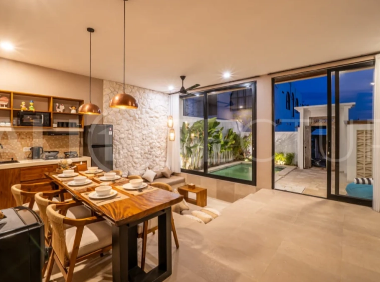 Brand-new 2-bedroom freehold villa near Pandawa Beach, featuring a modern tropical design, spacious interiors, high ceilings, large glass windows, private swimming pool, and elegant natural stone and wood finishes.