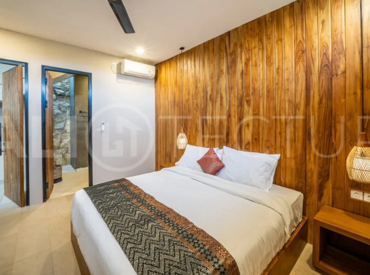 Brand-new 2-bedroom freehold villa near Pandawa Beach, featuring a modern tropical design, spacious interiors, high ceilings, large glass windows, private swimming pool, and elegant natural stone and wood finishes.