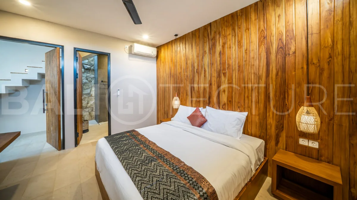 Brand-new 2-bedroom freehold villa near Pandawa Beach, featuring a modern tropical design, spacious interiors, high ceilings, large glass windows, private swimming pool, and elegant natural stone and wood finishes.