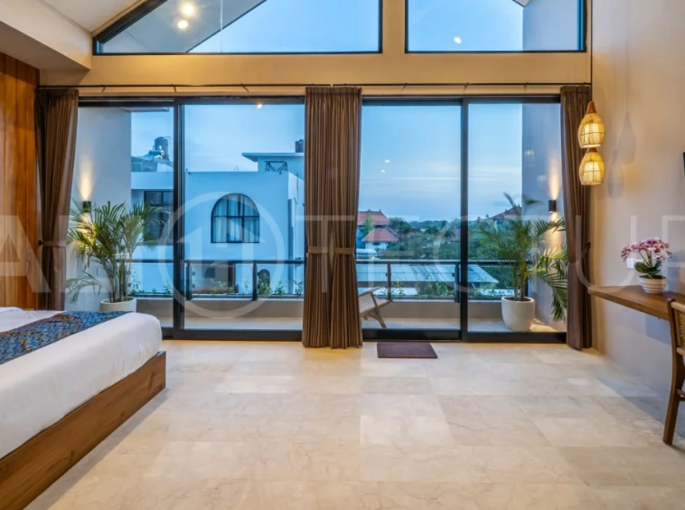 Brand-new 2-bedroom freehold villa near Pandawa Beach, featuring a modern tropical design, spacious interiors, high ceilings, large glass windows, private swimming pool, and elegant natural stone and wood finishes.