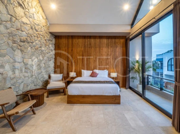 Brand-new 2-bedroom freehold villa near Pandawa Beach, featuring a modern tropical design, spacious interiors, high ceilings, large glass windows, private swimming pool, and elegant natural stone and wood finishes.