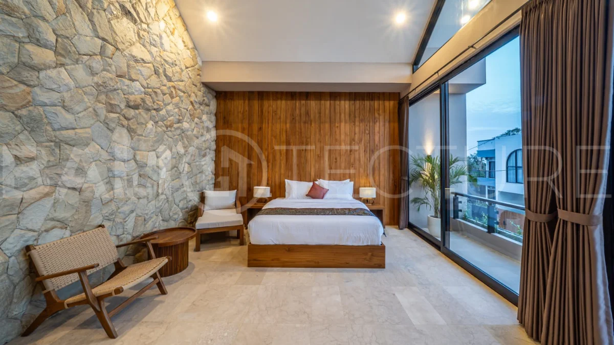 Brand-new 2-bedroom freehold villa near Pandawa Beach, featuring a modern tropical design, spacious interiors, high ceilings, large glass windows, private swimming pool, and elegant natural stone and wood finishes.