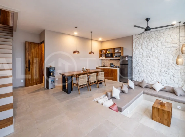 Brand-new 2-bedroom freehold villa near Pandawa Beach, featuring a modern tropical design, spacious interiors, high ceilings, large glass windows, private swimming pool, and elegant natural stone and wood finishes.