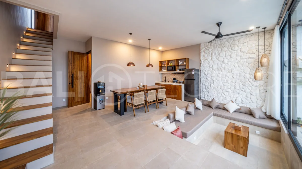 Brand-new 2-bedroom freehold villa near Pandawa Beach, featuring a modern tropical design, spacious interiors, high ceilings, large glass windows, private swimming pool, and elegant natural stone and wood finishes.