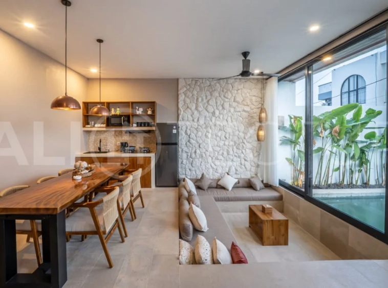 Brand-new 2-bedroom freehold villa near Pandawa Beach, featuring a modern tropical design, spacious interiors, high ceilings, large glass windows, private swimming pool, and elegant natural stone and wood finishes.