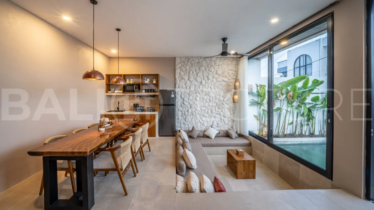 Brand-new 2-bedroom freehold villa near Pandawa Beach, featuring a modern tropical design, spacious interiors, high ceilings, large glass windows, private swimming pool, and elegant natural stone and wood finishes.