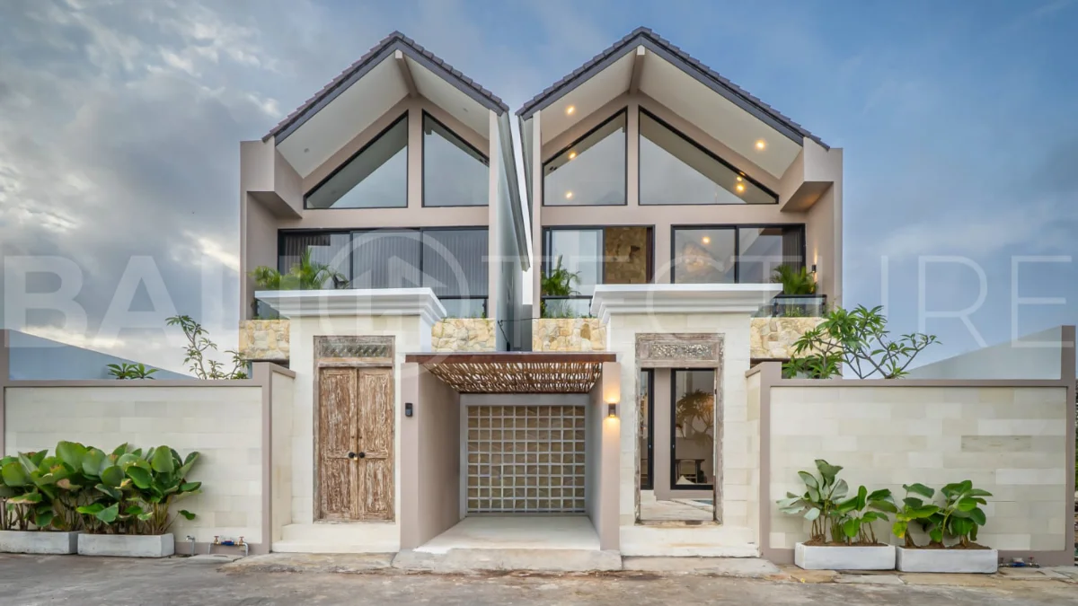 Brand-new 2-bedroom freehold villa near Pandawa Beach, featuring a modern tropical design, spacious interiors, high ceilings, large glass windows, private swimming pool, and elegant natural stone and wood finishes.