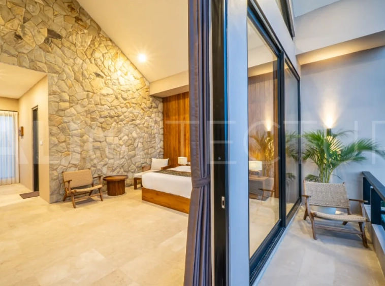 Brand-new 2-bedroom freehold villa near Pandawa Beach, featuring a modern tropical design, spacious interiors, high ceilings, large glass windows, private swimming pool, and elegant natural stone and wood finishes.