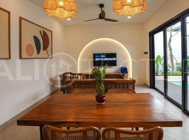 Modern 2-bedroom villa for sale in Jimbaran, Bali, featuring a contemporary open-plan design, 126 sqm of living space, two en-suite bedrooms, full furnishings, premium community facilities, and a 100-year leasehold option.