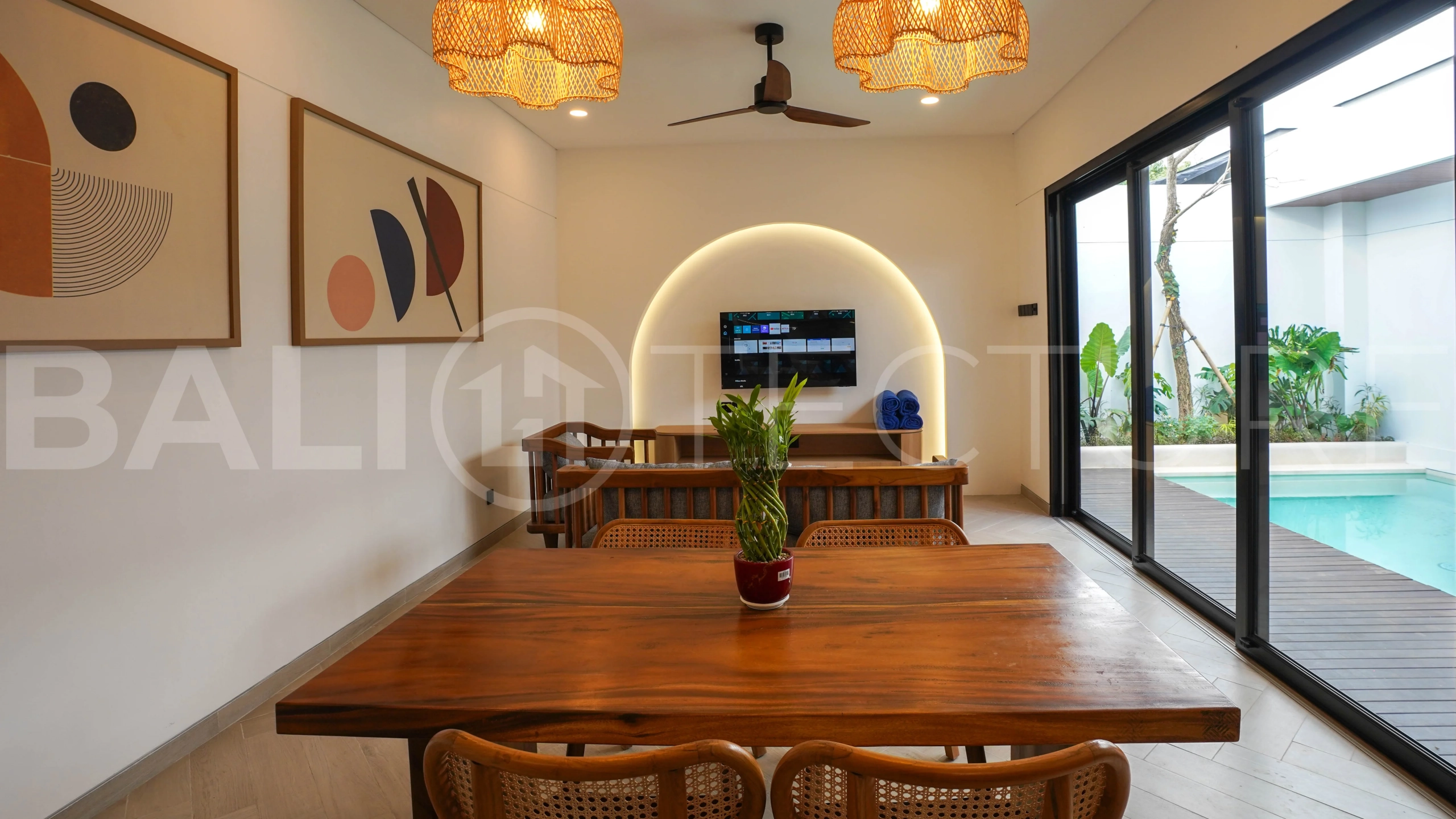 Modern 2-bedroom villa for sale in Jimbaran, Bali, featuring a contemporary open-plan design, 126 sqm of living space, two en-suite bedrooms, full furnishings, premium community facilities, and a 100-year leasehold option.
