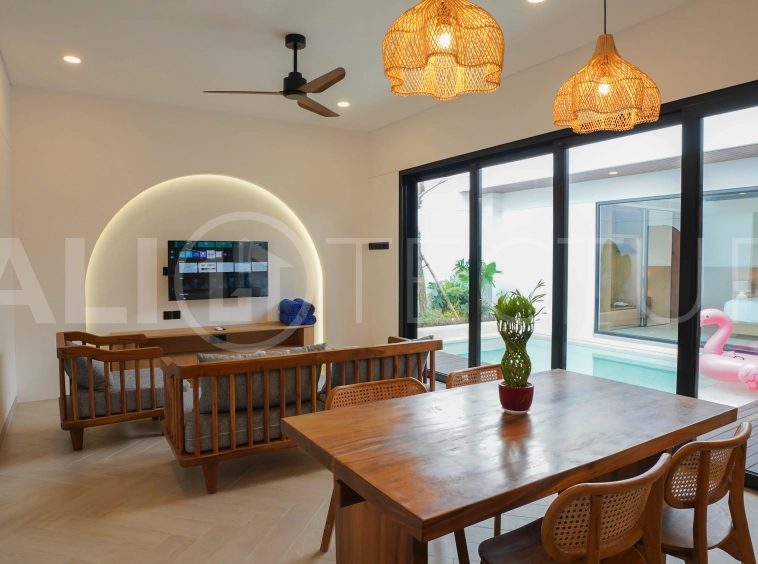 Modern 2-bedroom villa for sale in Jimbaran, Bali, featuring a contemporary open-plan design, 126 sqm of living space, two en-suite bedrooms, full furnishings, premium community facilities, and a 100-year leasehold option.