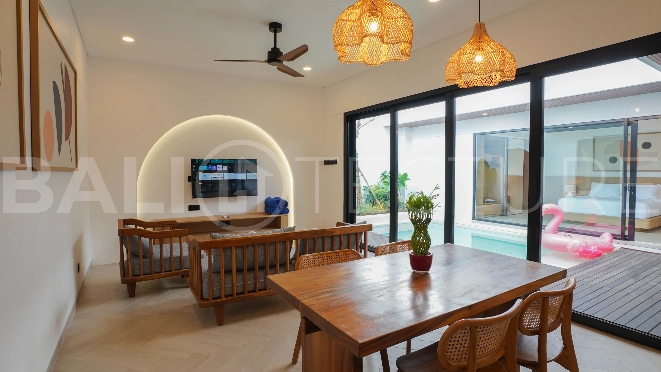Modern 2-bedroom villa for sale in Jimbaran, Bali, featuring a contemporary open-plan design, 126 sqm of living space, two en-suite bedrooms, full furnishings, premium community facilities, and a 100-year leasehold option.