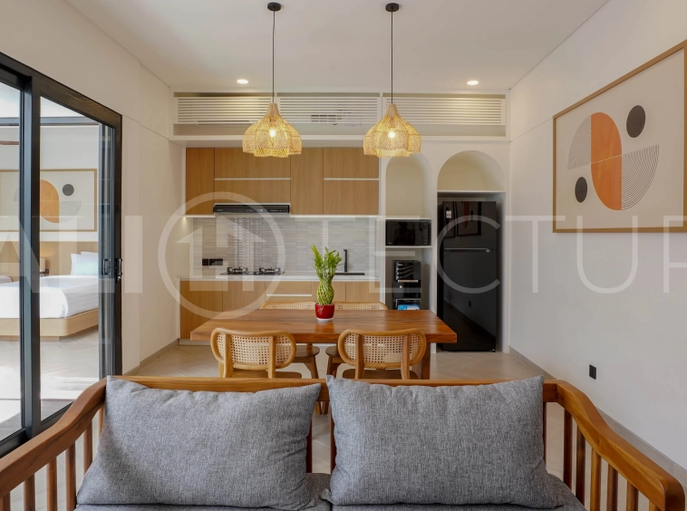 Modern 2-bedroom villa for sale in Jimbaran, Bali, featuring a contemporary open-plan design, 126 sqm of living space, two en-suite bedrooms, full furnishings, premium community facilities, and a 100-year leasehold option.