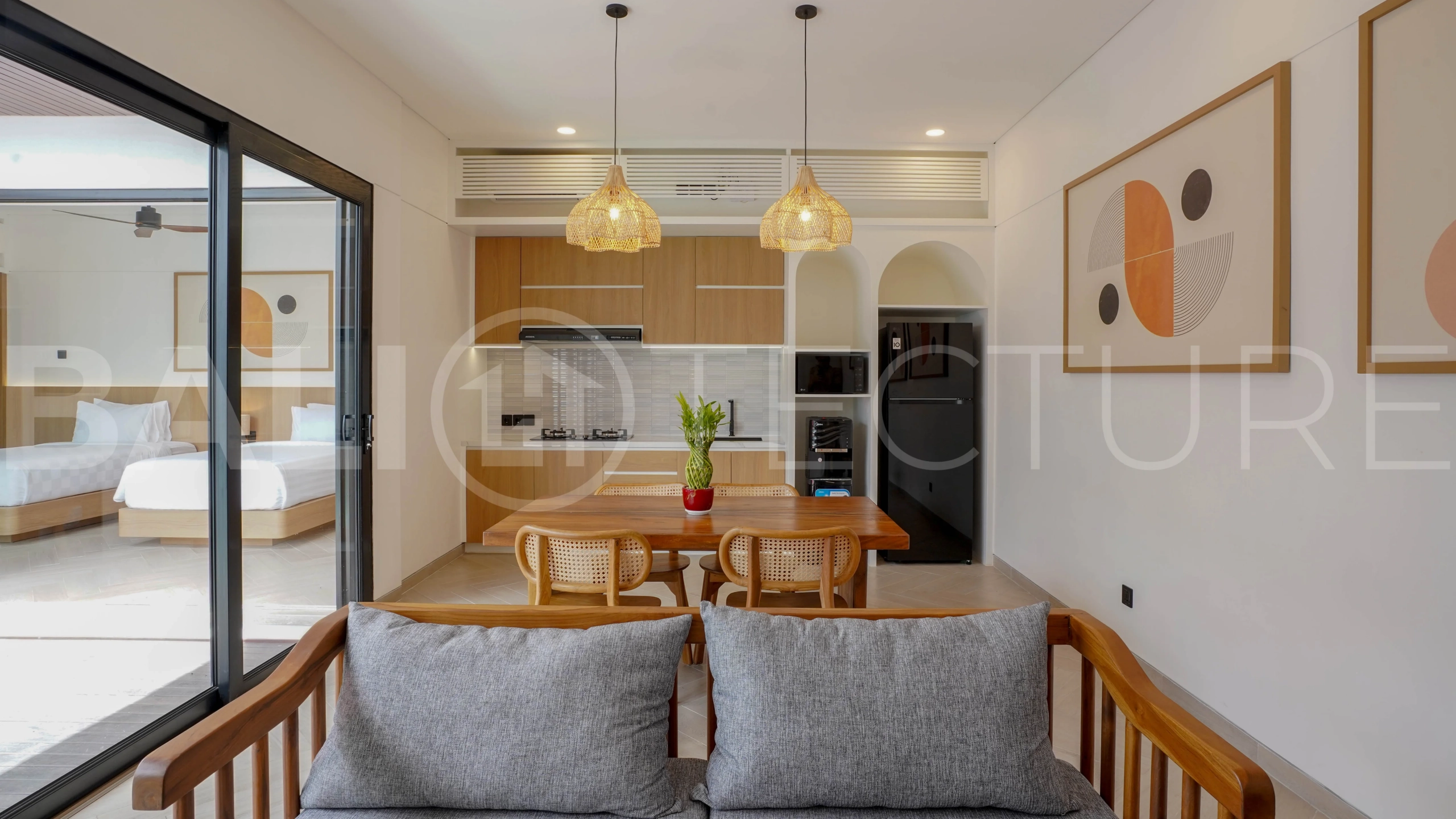 Modern 2-bedroom villa for sale in Jimbaran, Bali, featuring a contemporary open-plan design, 126 sqm of living space, two en-suite bedrooms, full furnishings, premium community facilities, and a 100-year leasehold option.