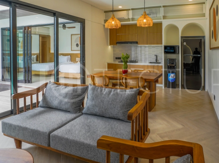 Modern 2-bedroom villa for sale in Jimbaran, Bali, featuring a contemporary open-plan design, 126 sqm of living space, two en-suite bedrooms, full furnishings, premium community facilities, and a 100-year leasehold option.