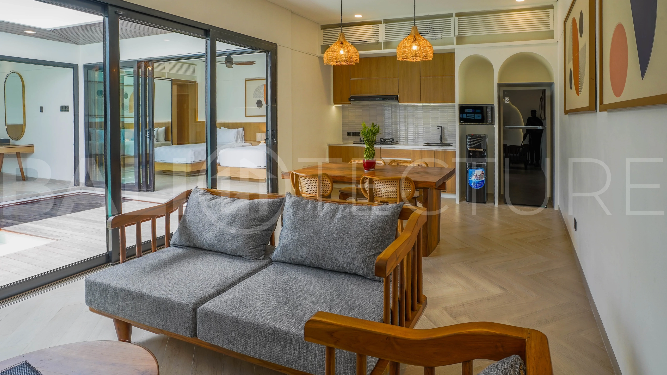 Modern 2-bedroom villa for sale in Jimbaran, Bali, featuring a contemporary open-plan design, 126 sqm of living space, two en-suite bedrooms, full furnishings, premium community facilities, and a 100-year leasehold option.