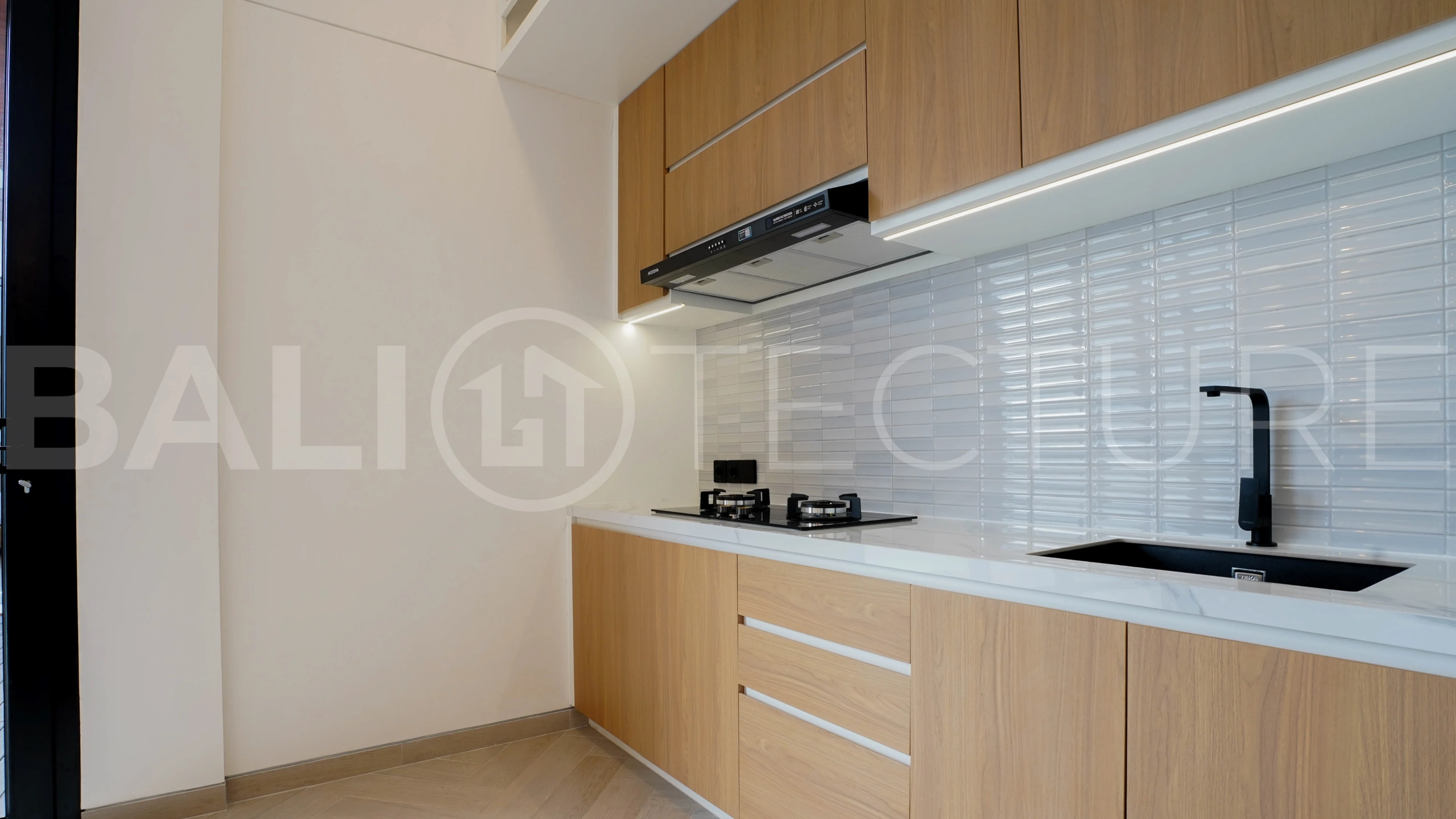 Modern 2-bedroom villa for sale in Jimbaran, Bali, featuring a contemporary open-plan design, 126 sqm of living space, two en-suite bedrooms, full furnishings, premium community facilities, and a 100-year leasehold option.