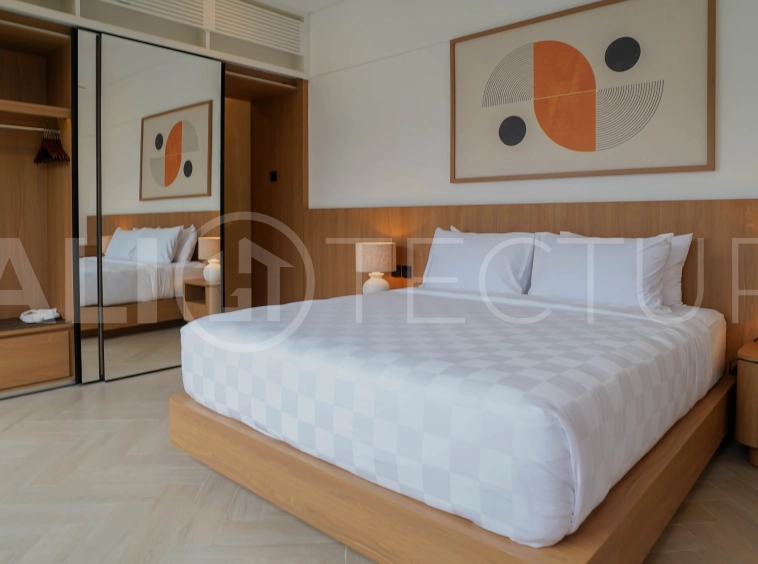 Modern 2-bedroom villa for sale in Jimbaran, Bali, featuring a contemporary open-plan design, 126 sqm of living space, two en-suite bedrooms, full furnishings, premium community facilities, and a 100-year leasehold option.