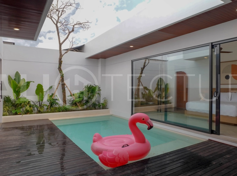 Modern 2-bedroom villa for sale in Jimbaran, Bali, featuring a contemporary open-plan design, 126 sqm of living space, two en-suite bedrooms, full furnishings, premium community facilities, and a 100-year leasehold option.
