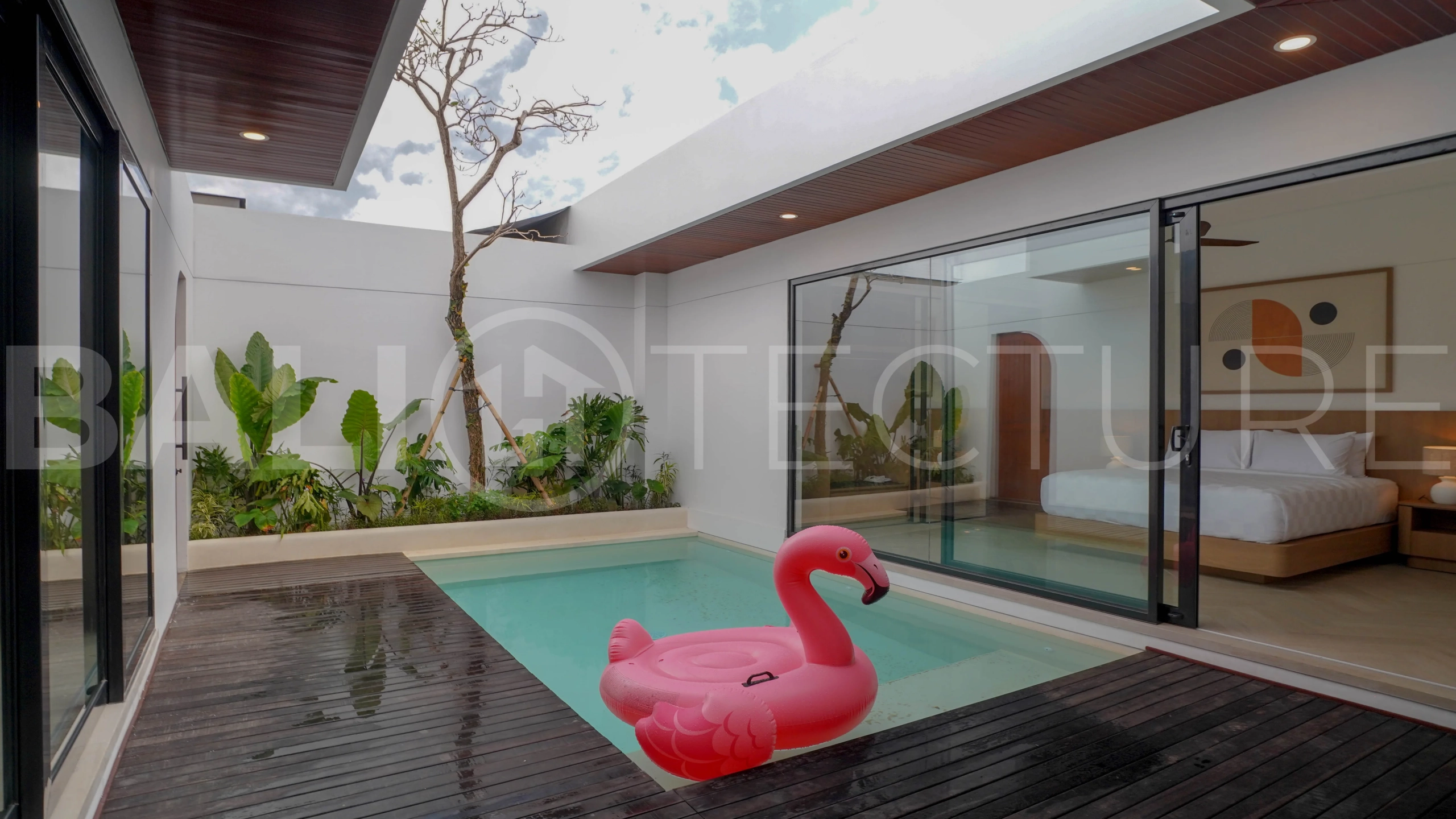 Modern 2-bedroom villa for sale in Jimbaran, Bali, featuring a contemporary open-plan design, 126 sqm of living space, two en-suite bedrooms, full furnishings, premium community facilities, and a 100-year leasehold option.