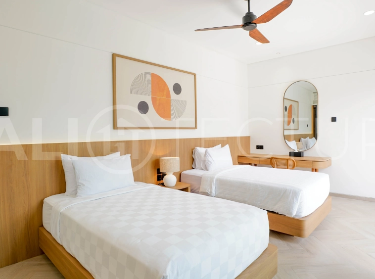 Modern 2-bedroom villa for sale in Jimbaran, Bali, featuring a contemporary open-plan design, 126 sqm of living space, two en-suite bedrooms, full furnishings, premium community facilities, and a 100-year leasehold option.