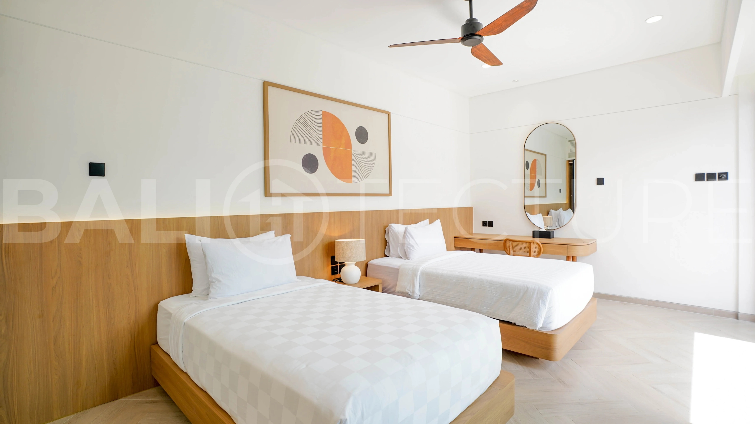 Modern 2-bedroom villa for sale in Jimbaran, Bali, featuring a contemporary open-plan design, 126 sqm of living space, two en-suite bedrooms, full furnishings, premium community facilities, and a 100-year leasehold option.