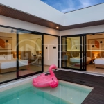 Modern 2-bedroom villa for sale in Jimbaran, Bali, featuring a contemporary open-plan design, 126 sqm of living space, two en-suite bedrooms, full furnishings, premium community facilities, and a 100-year leasehold option.