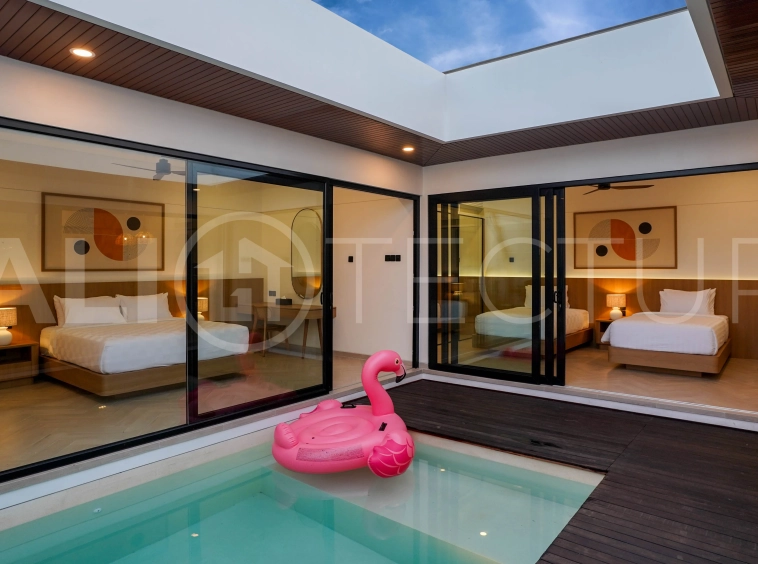 Modern 2-bedroom villa for sale in Jimbaran, Bali, featuring a contemporary open-plan design, 126 sqm of living space, two en-suite bedrooms, full furnishings, premium community facilities, and a 100-year leasehold option.
