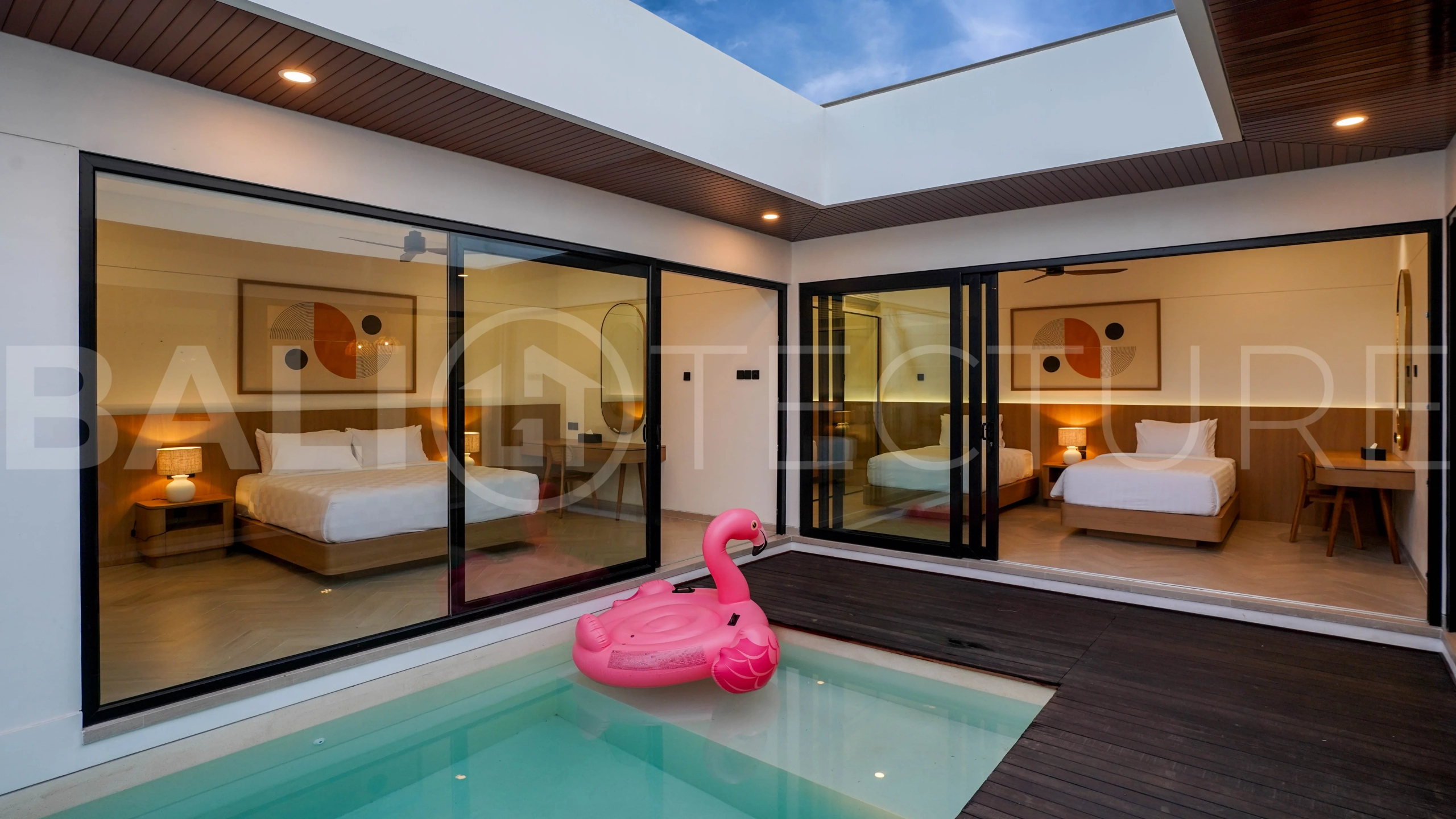 Modern 2-bedroom villa for sale in Jimbaran, Bali, featuring a contemporary open-plan design, 126 sqm of living space, two en-suite bedrooms, full furnishings, premium community facilities, and a 100-year leasehold option.
