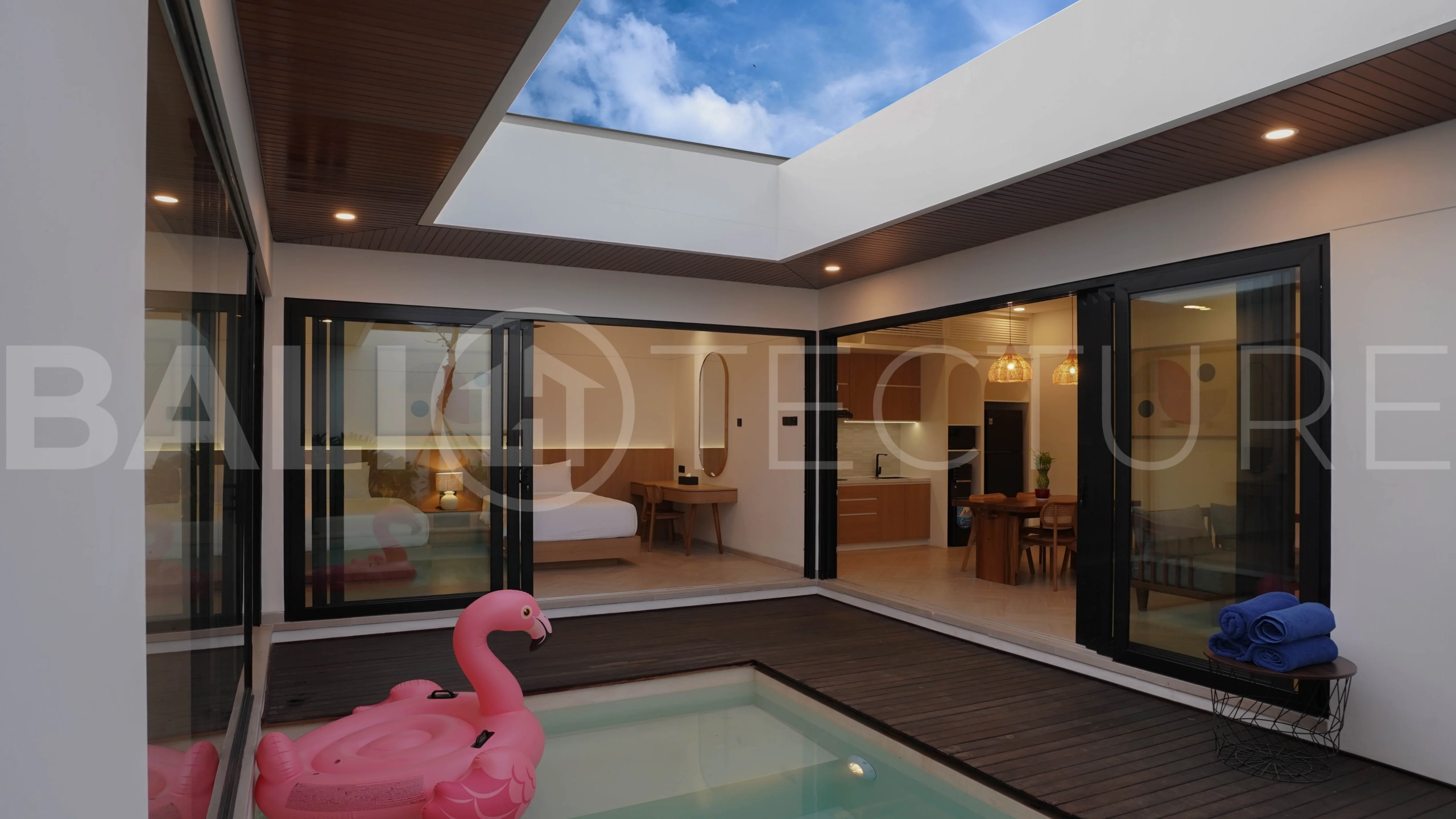 Modern 2-bedroom villa for sale in Jimbaran, Bali, featuring a contemporary open-plan design, 126 sqm of living space, two en-suite bedrooms, full furnishings, premium community facilities, and a 100-year leasehold option.