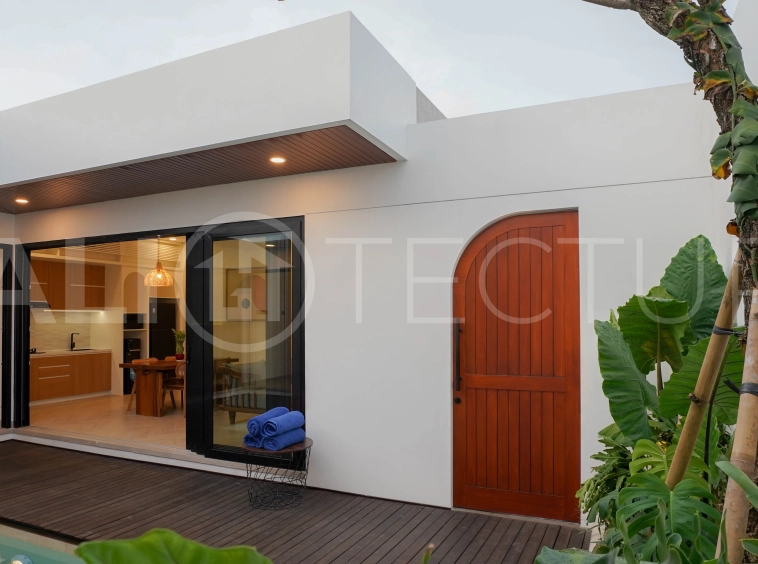Modern 2-bedroom villa for sale in Jimbaran, Bali, featuring a contemporary open-plan design, 126 sqm of living space, two en-suite bedrooms, full furnishings, premium community facilities, and a 100-year leasehold option.