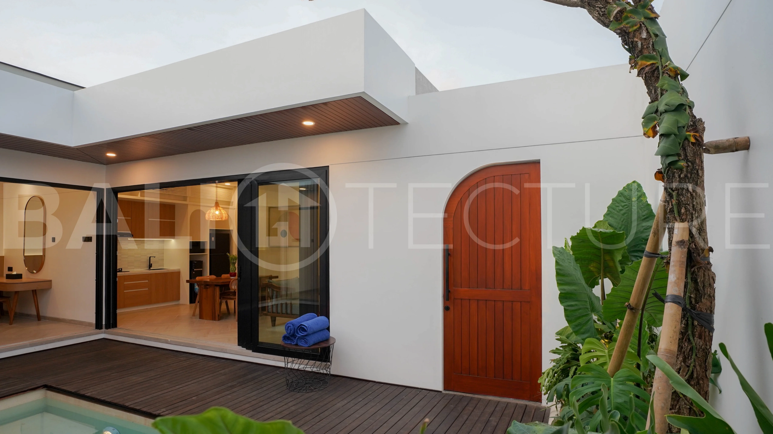 Modern 2-bedroom villa for sale in Jimbaran, Bali, featuring a contemporary open-plan design, 126 sqm of living space, two en-suite bedrooms, full furnishings, premium community facilities, and a 100-year leasehold option.