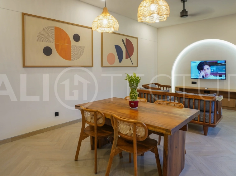 Modern 2-bedroom villa for sale in Jimbaran, Bali, featuring a contemporary open-plan design, 126 sqm of living space, two en-suite bedrooms, full furnishings, premium community facilities, and a 100-year leasehold option.