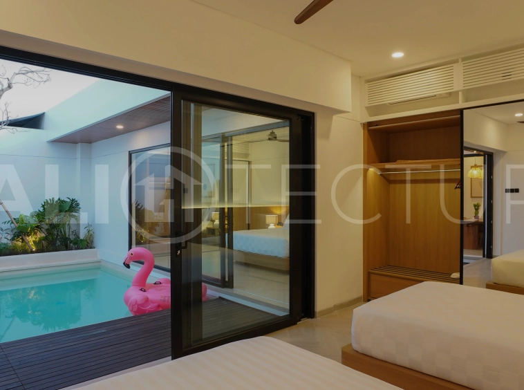 Modern 2-bedroom villa for sale in Jimbaran, Bali, featuring a contemporary open-plan design, 126 sqm of living space, two en-suite bedrooms, full furnishings, premium community facilities, and a 100-year leasehold option.
