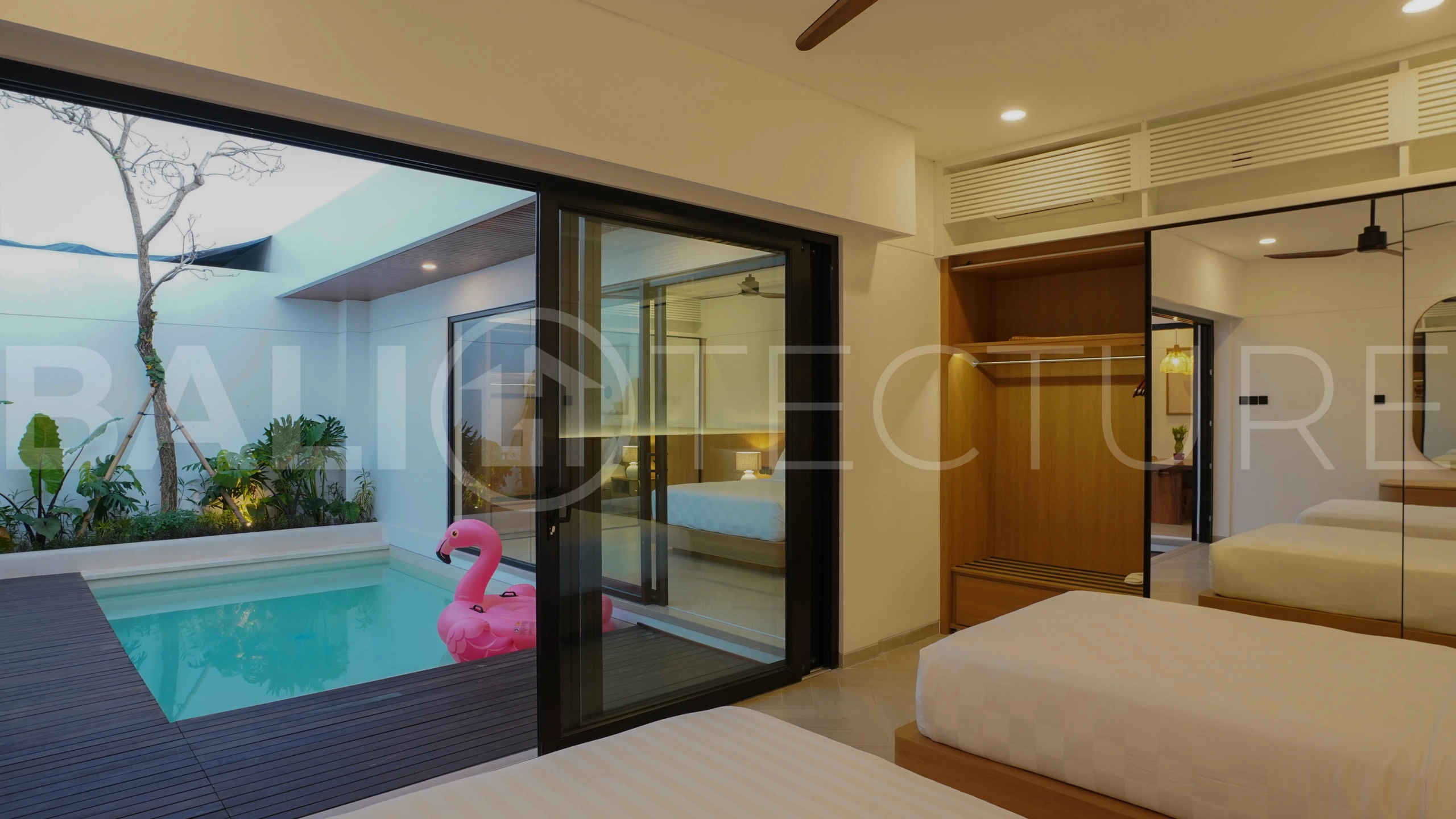 Modern 2-bedroom villa for sale in Jimbaran, Bali, featuring a contemporary open-plan design, 126 sqm of living space, two en-suite bedrooms, full furnishings, premium community facilities, and a 100-year leasehold option.