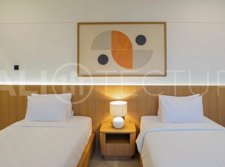 Modern 2-bedroom villa for sale in Jimbaran, Bali, featuring a contemporary open-plan design, 126 sqm of living space, two en-suite bedrooms, full furnishings, premium community facilities, and a 100-year leasehold option.