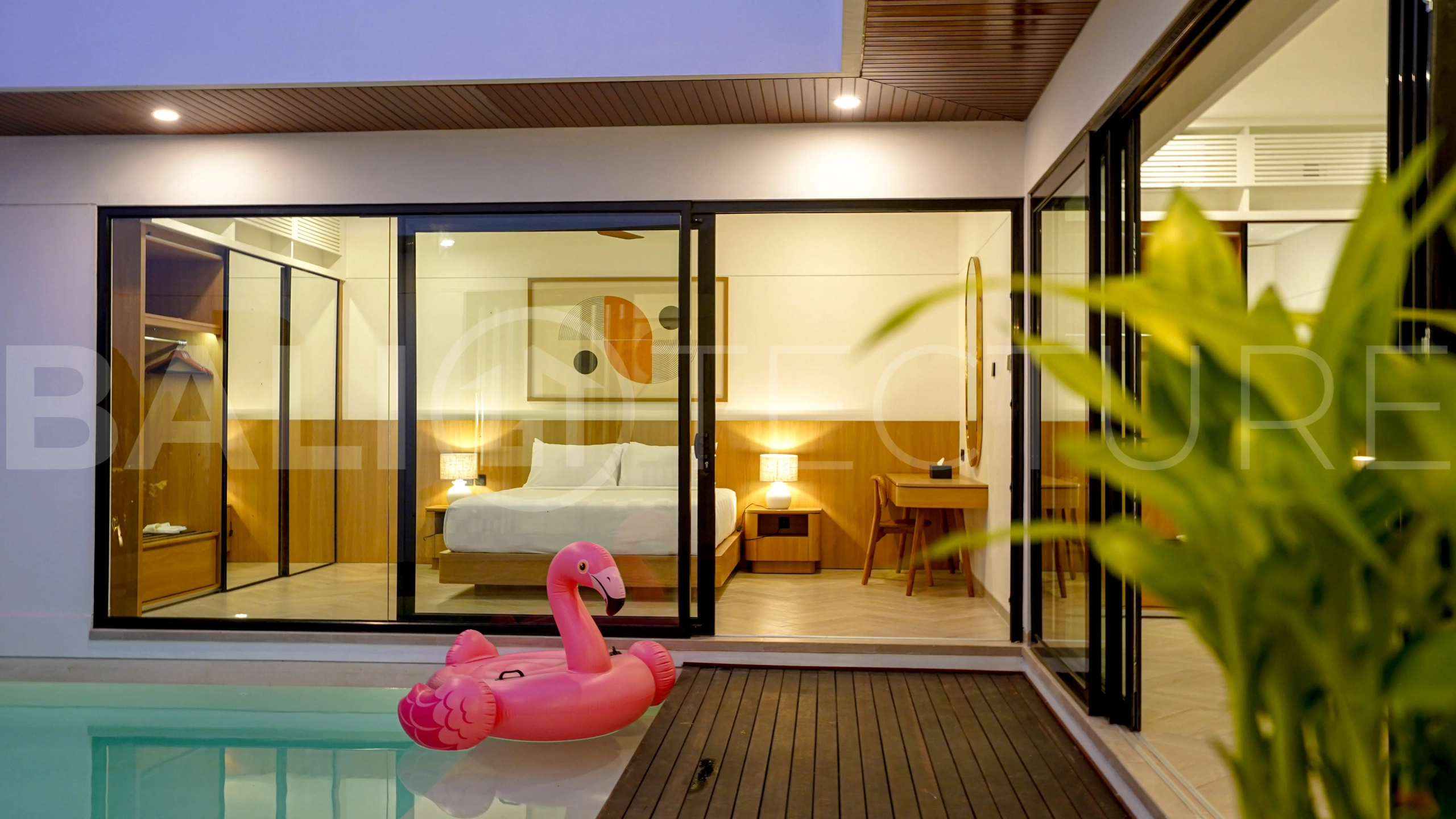 Modern 2-bedroom villa for sale in Jimbaran, Bali, featuring a contemporary open-plan design, 126 sqm of living space, two en-suite bedrooms, full furnishings, premium community facilities, and a 100-year leasehold option.