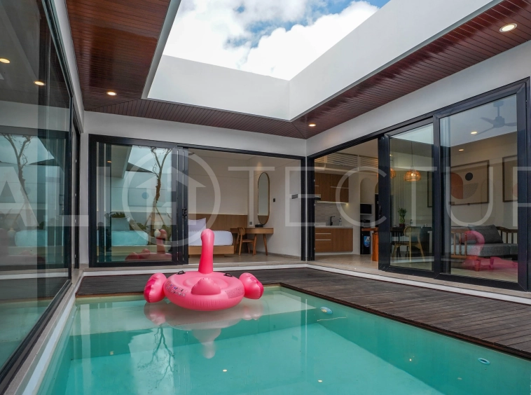 Modern 2-bedroom villa for sale in Jimbaran, Bali, featuring a contemporary open-plan design, 126 sqm of living space, two en-suite bedrooms, full furnishings, premium community facilities, and a 100-year leasehold option.
