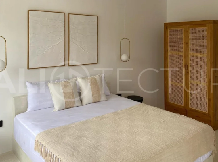 Modern 1-bedroom villa for sale in Balangan featuring a private swimming pool, tropical garden, wooden pool deck, minimalist interiors, and a peaceful residential setting near Balangan Beach.