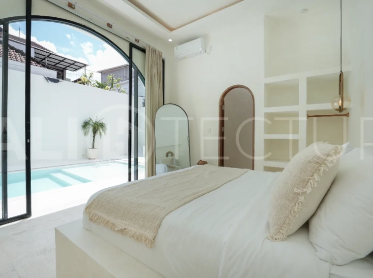 Newly built modern minimalist 2-bedroom villa in Padonan, Canggu, featuring a private swimming pool, tropical landscaping, enclosed living areas, and a contemporary tropical design.