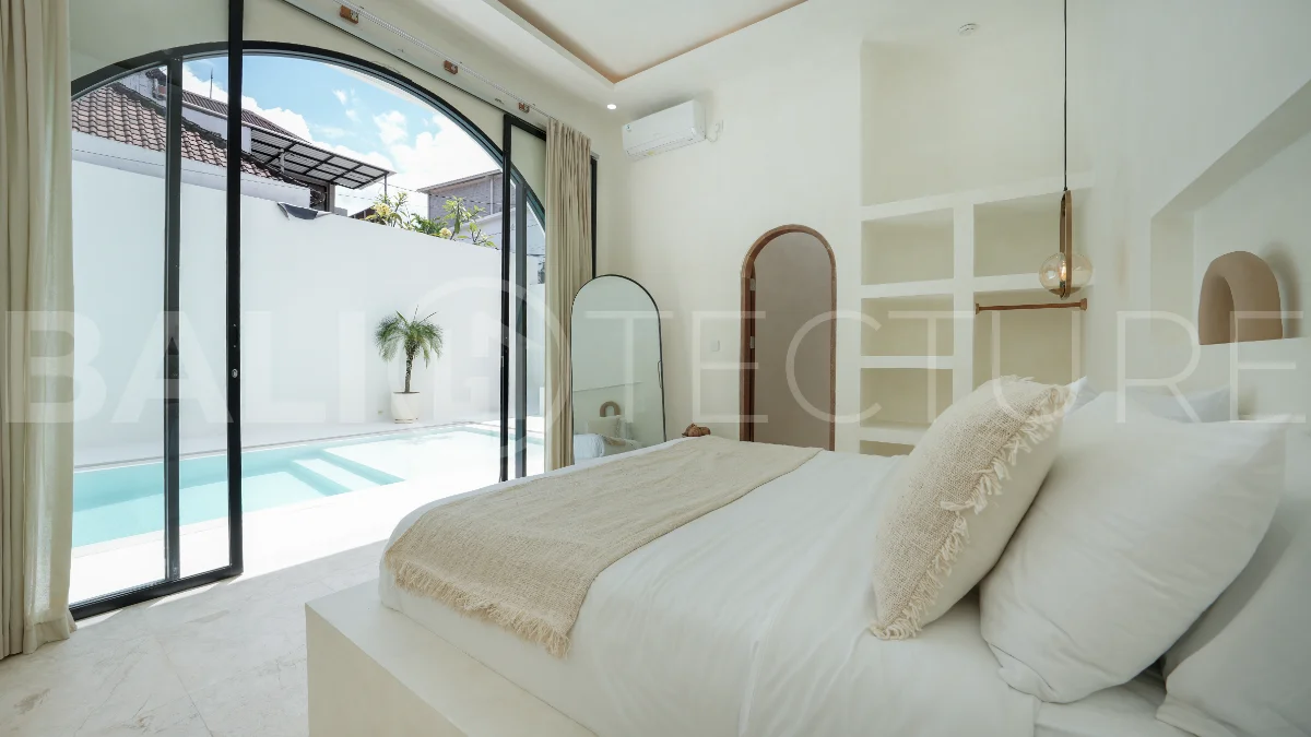Newly built modern minimalist 2-bedroom villa in Padonan, Canggu, featuring a private swimming pool, tropical landscaping, enclosed living areas, and a contemporary tropical design.