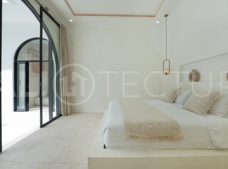 Newly built modern minimalist 2-bedroom villa in Padonan, Canggu, featuring a private swimming pool, tropical landscaping, enclosed living areas, and a contemporary tropical design.