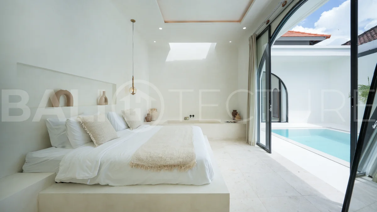 Newly built modern minimalist 2-bedroom villa in Padonan, Canggu, featuring a private swimming pool, tropical landscaping, enclosed living areas, and a contemporary tropical design.