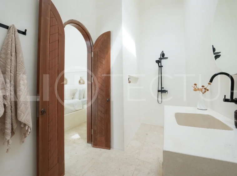 Newly built modern minimalist 2-bedroom villa in Padonan, Canggu, featuring a private swimming pool, tropical landscaping, enclosed living areas, and a contemporary tropical design.