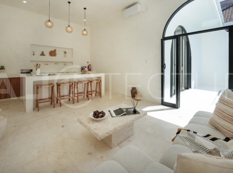 Newly built modern minimalist 2-bedroom villa in Padonan, Canggu, featuring a private swimming pool, tropical landscaping, enclosed living areas, and a contemporary tropical design.