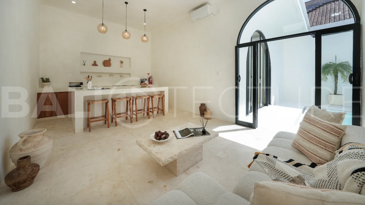 Newly built modern minimalist 2-bedroom villa in Padonan, Canggu, featuring a private swimming pool, tropical landscaping, enclosed living areas, and a contemporary tropical design.