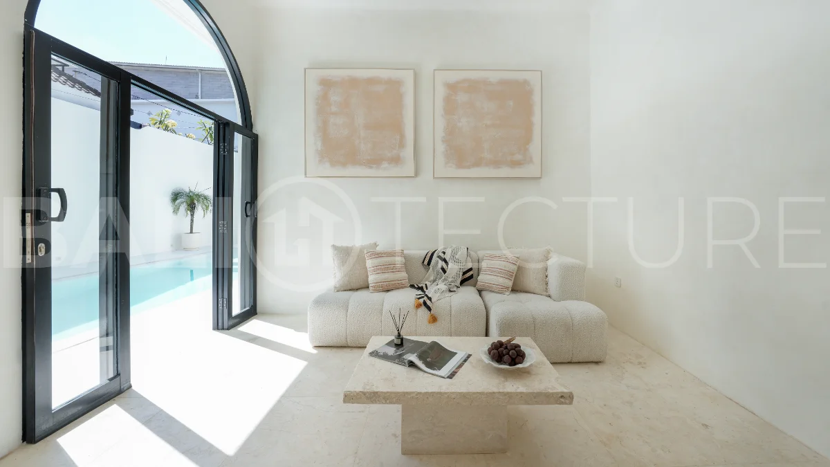 Newly built modern minimalist 2-bedroom villa in Padonan, Canggu, featuring a private swimming pool, tropical landscaping, enclosed living areas, and a contemporary tropical design.
