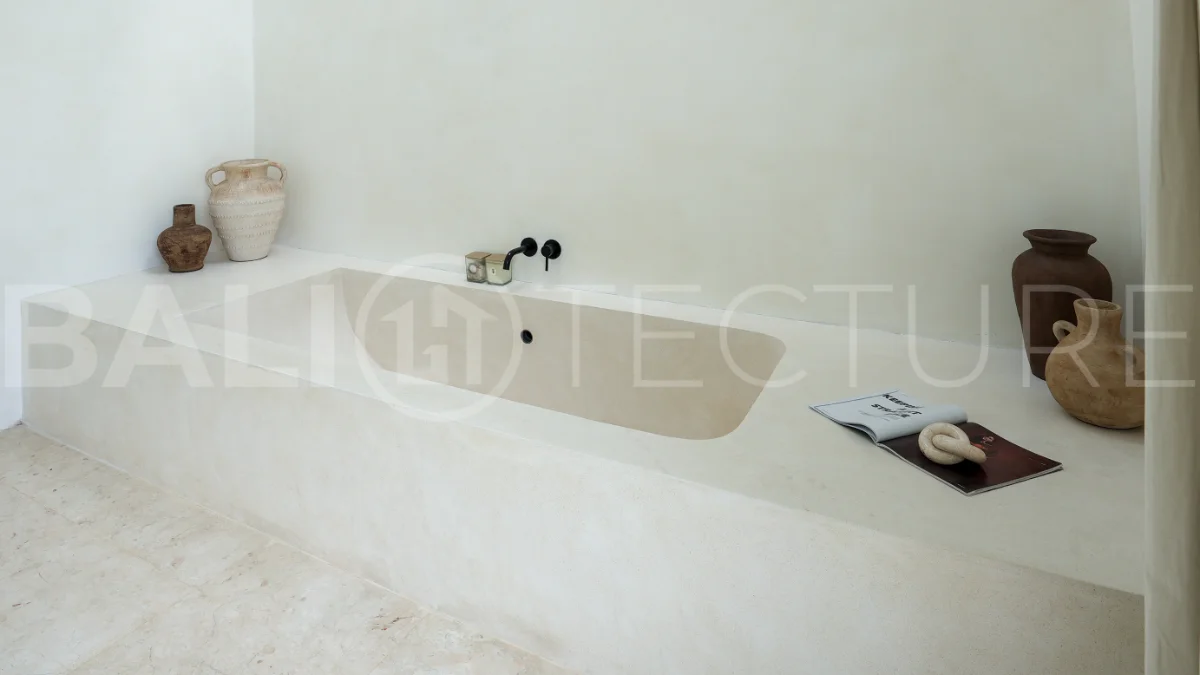 Newly built modern minimalist 2-bedroom villa in Padonan, Canggu, featuring a private swimming pool, tropical landscaping, enclosed living areas, and a contemporary tropical design.