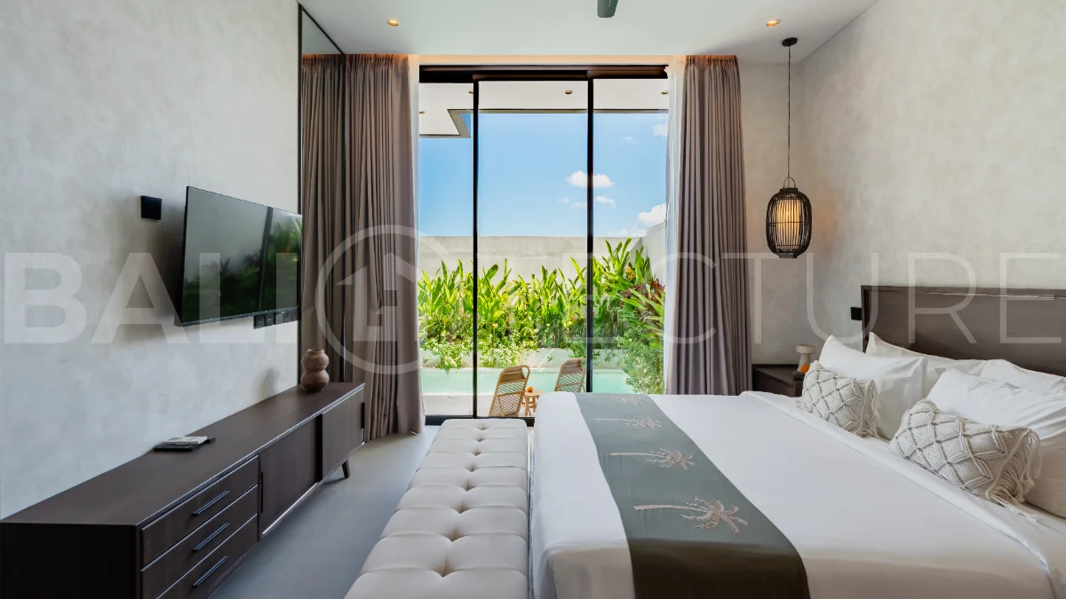 Modern 2-bedroom villa for sale near Pererenan Beach, Canggu, featuring stylish interiors, spacious living areas, tropical greenery, and a private swimming pool.